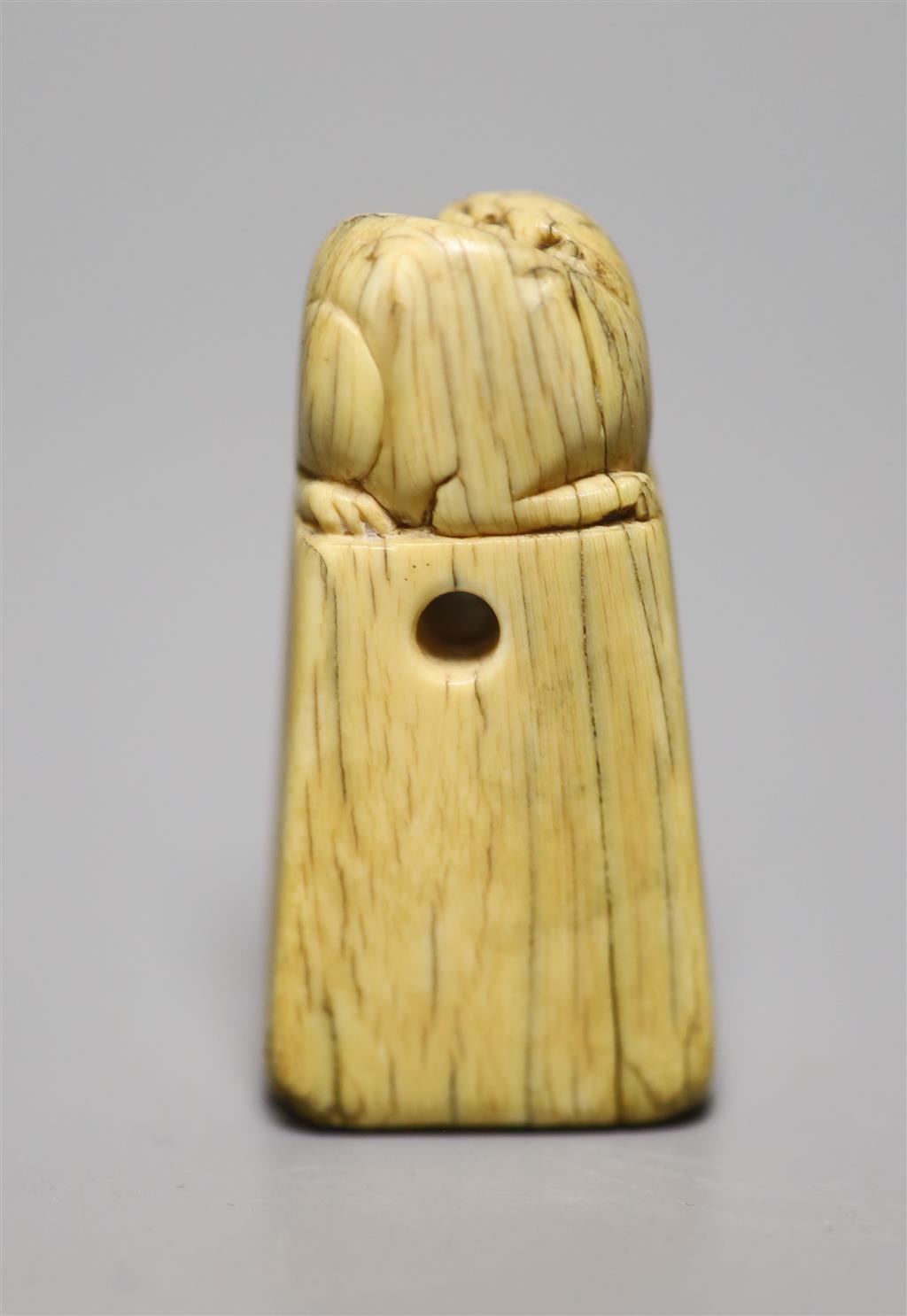A Chinese Ming ivory seal, height 5cm, carved with a lion-dog